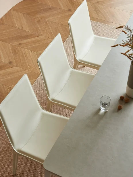 Light luxury cream dining table and chair, Italian style desk and chair, modern minimalist backrest, saddle leather stool